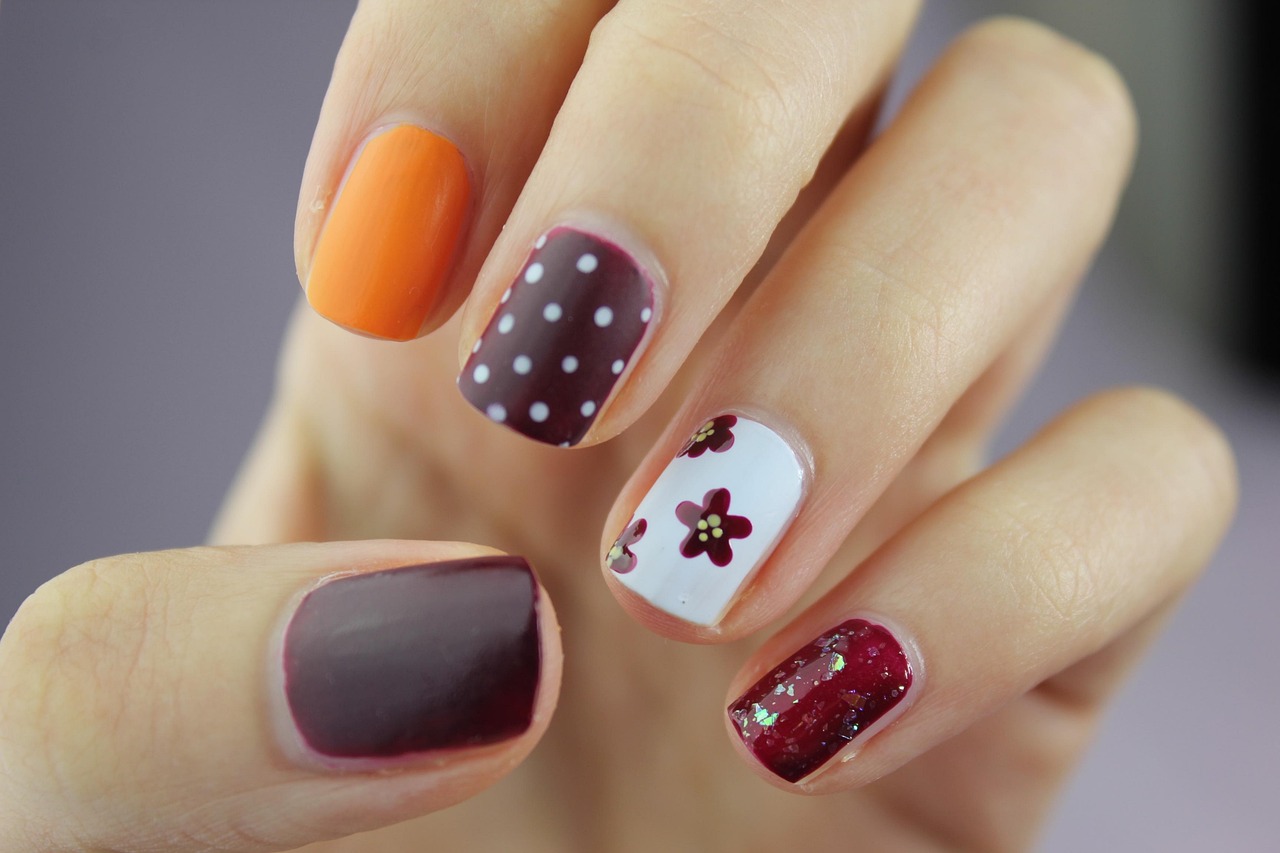 Mixed nail art with polka dots and flowers
